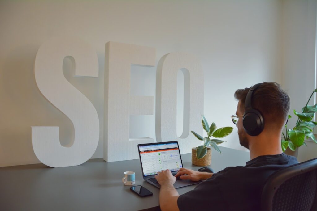 How to Do SEO Content Writing Like a Pro Even If It Is Your First Time SEO content writing on a laptop with search engine results and organic traffic dashboard